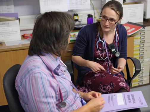 Female consultant with colleague